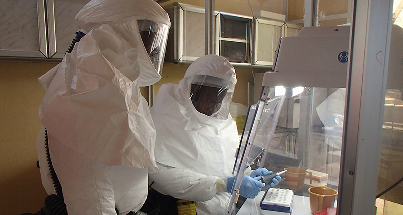 Technicians set up an assay test for Ebola, Fort Detrick, MD, 2000. Photo by Randal Schoepp, USAMRIID